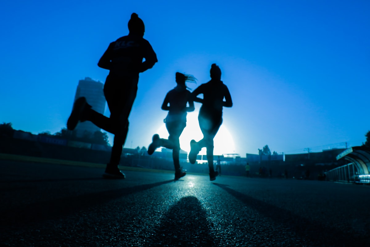 Athletes running at dawn